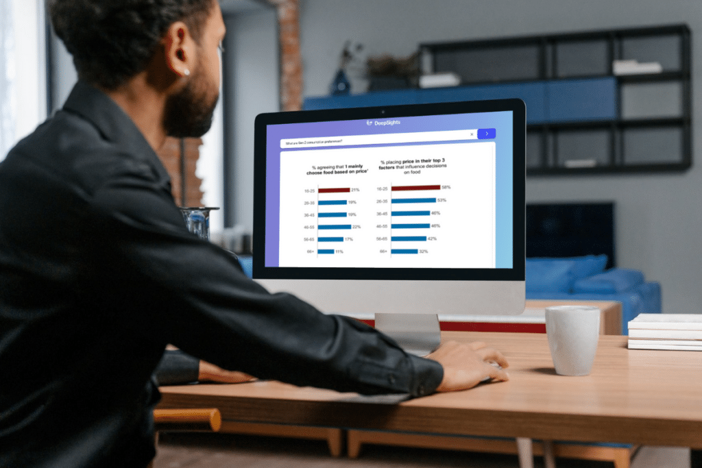 man looking at a screen with graphs and data
