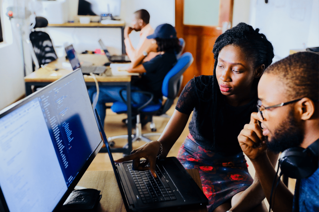 Market research vs. insights: two people researching the topic on a screen