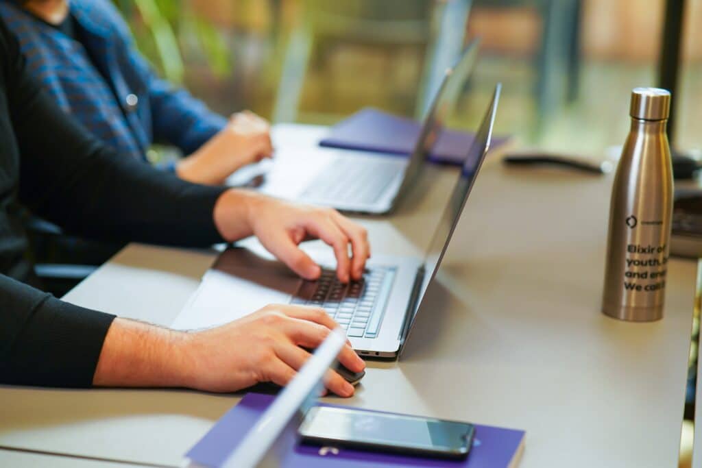 people looking at consumer insights on a laptop